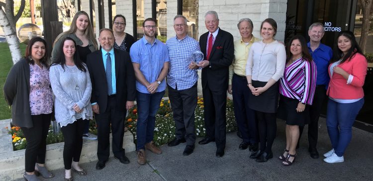 Employees from Willow Glen agency accepting award from CIG representatives.